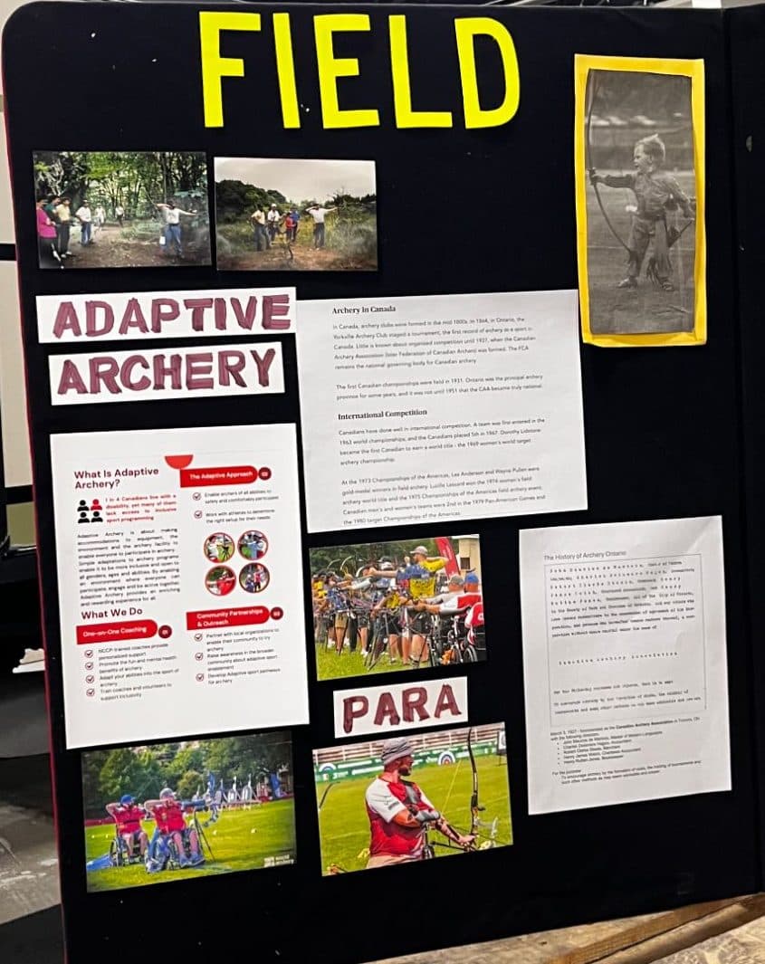 A display board titled Field with an Adaptive Archery section and our flyer pinned to it.